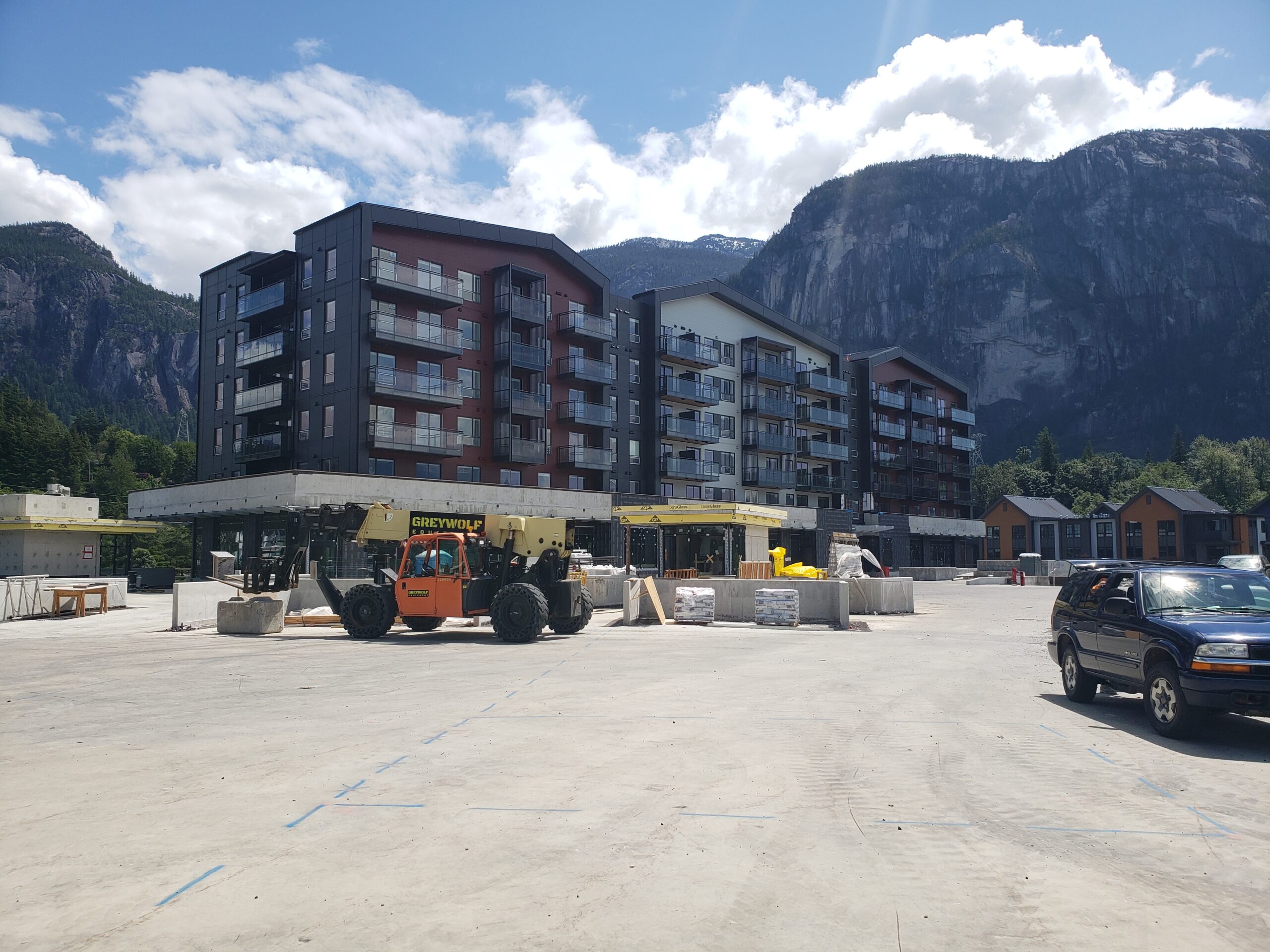 Sea and Sky B Building with mountains behind